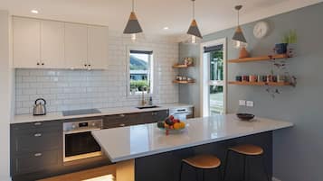 Enjoy a functional workspace and casual dining area with a large window offering a view of the outdoors.