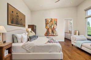 A bedroom with a large bed, a nightstand, a dresser, a window, and a painting on the wall. - Magnificent Panoramic Valley and Vineyard Views, Single Level Two Guest Suite Layout, Amazing Deck (Dundee)