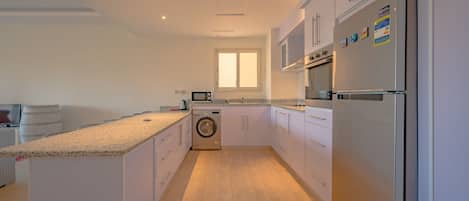 Luxury Apartment | Private kitchen | Microwave, oven, electric kettle, cookware/dishes/utensils