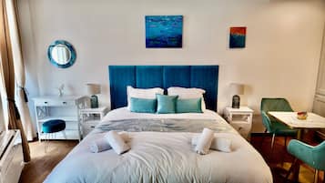 1 bedroom, desk, iron/ironing board, travel crib