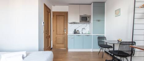1 bedroom, desk, iron/ironing board, travel crib