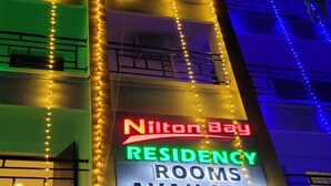 A sign for 'Nilton Bay Residency' with rooms available, indicating A/C and non-A/C options. - Nilton Bay Residency (Tindivanam)