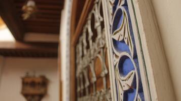A close-up of a decorative metal gate with intricate designs.