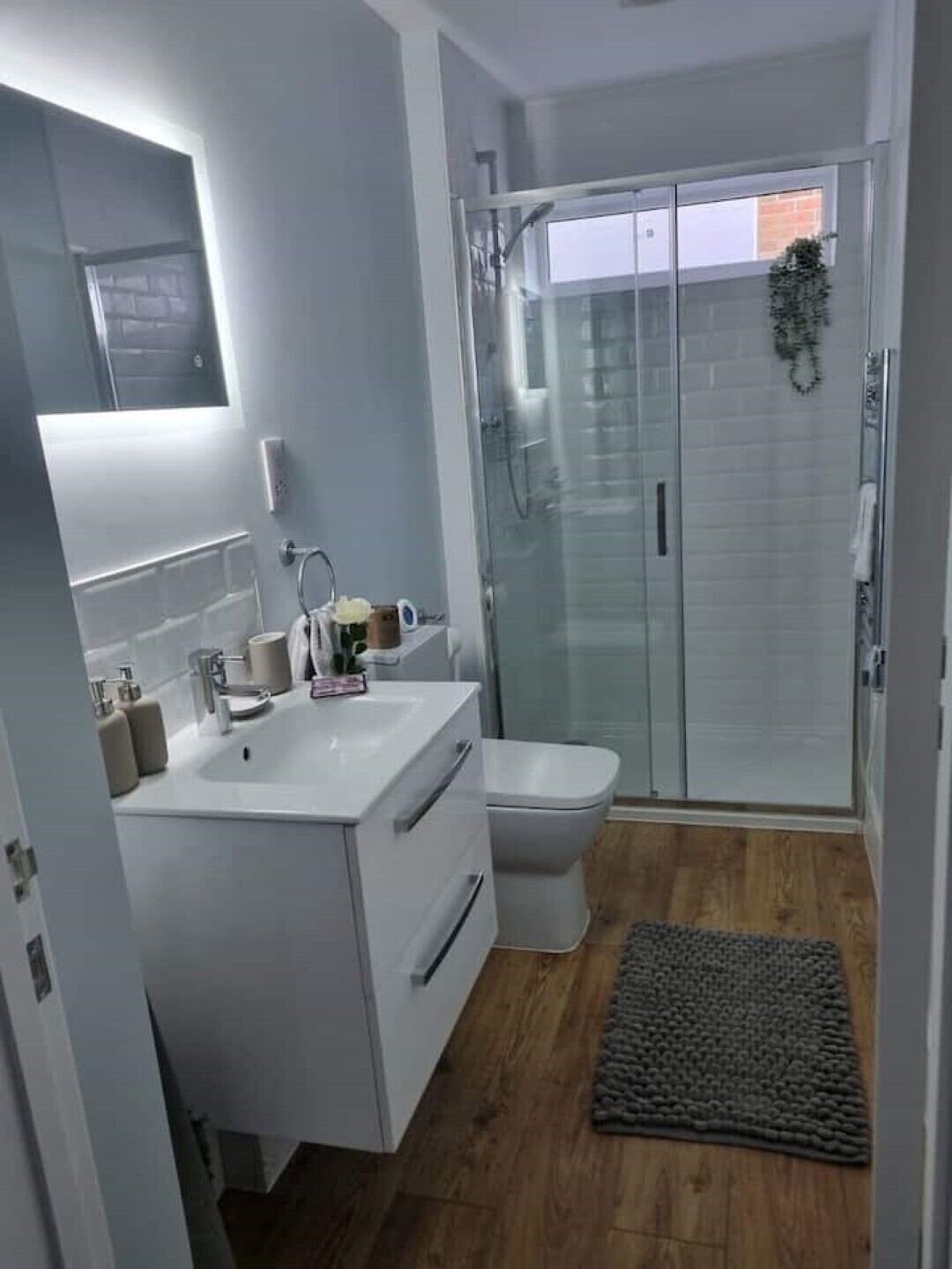 Shower, hair dryer, slippers, towels