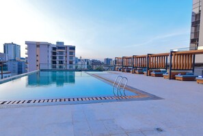 Outdoor pool, a heated pool, pool loungers