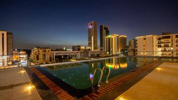 Outdoor pool, a heated pool, sun loungers