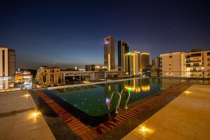 Outdoor pool, a heated pool, pool loungers