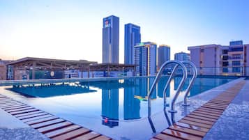 Outdoor pool, a heated pool, sun loungers