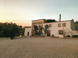 A two-story building with a stone facade, multiple windows, and a chimney. - nowenqew;PIHFR' (Cunit)