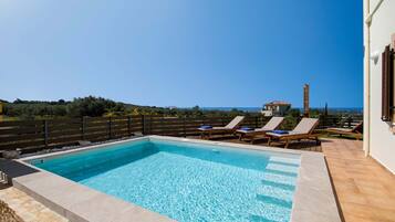 Outdoor pool, pool umbrellas, pool loungers