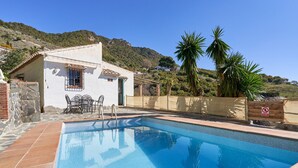 A swimming pool with a patio area, a small building with a window, and a view of a hillside. - Country House 'La Solana' with Sea View, Private Pool and Wi-Fi (Frigiliana)