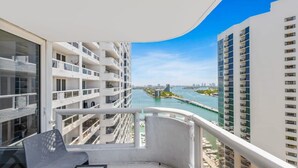 A balcony with a view of a marina and high-rise buildings. - Bay View High-Rise | Private Balcony | StayCozy (Miami)