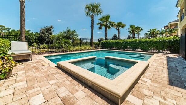 A rectangular pool with a tiled border, surrounded by a paved patio. - Reunion Resort- Pool, Spa, Game Room, Disney, Golf Course, No resort Fees (Reunion)