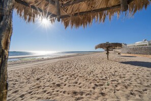 On the beach, sun loungers, beach towels