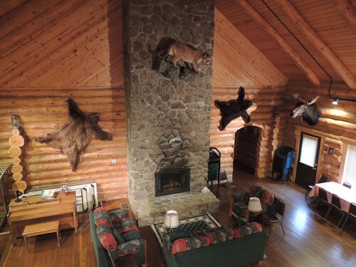 Large log building in the country near a creek