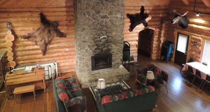 Large log building in the country near a creek