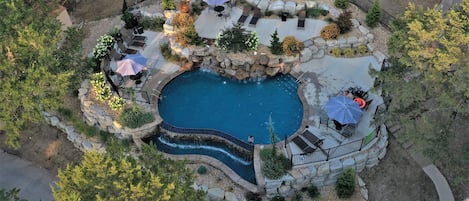 Seasonal outdoor pool, open 10:00 AM to 10:00 PM, pool umbrellas