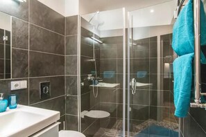 Shower, hair dryer, towels, soap