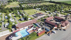An aerial view of a campground with a swimming pool, water park, and various buildings. - First Camp Hasmark Strand Fyn (Otterup)