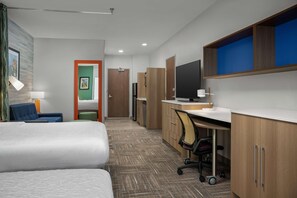 A hotel room with a bed, a desk, a chair, a television, and a bathroom. - Home2 Suites By Hilton Cullman (Cullman)