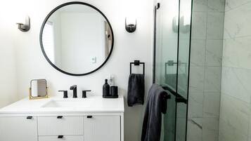 Shower, hair dryer, towels, soap