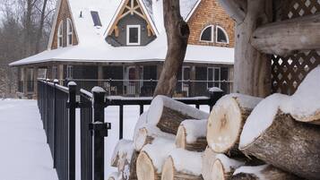 Cozy retreat with a rustic wooden structure and a warm fireplace.