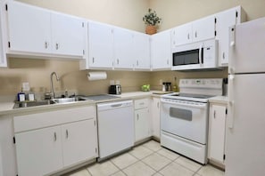 Fridge, microwave, oven, stovetop - The Nomad at Gables | King Bed • Pool • Garage (Gainesville)