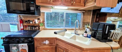 Fridge, microwave, stovetop, coffee/tea maker