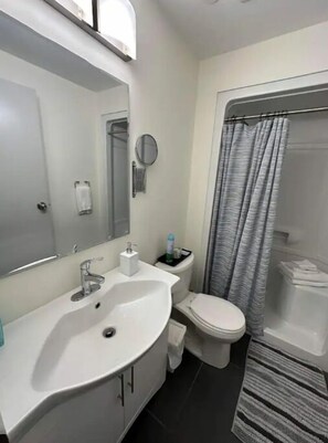 Shower, hair dryer, towels, soap