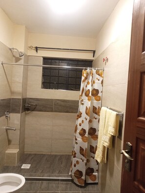 Shower, towels, soap, toilet paper - Nakuru 2 Bedroom Master Ensuite Executive Apartment-Alizeti Homes (Nakuru)