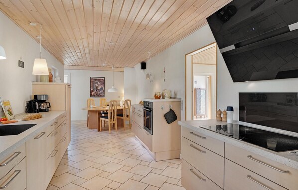 Fridge, stovetop, dishwasher, coffee/tea maker
