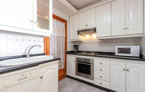 Microwave, stovetop, cookware/dishes/utensils