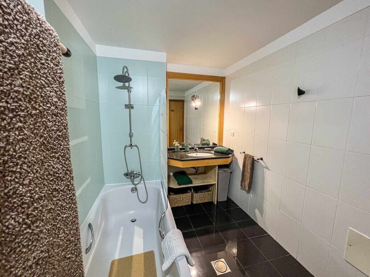 Bathtub, hair dryer, towels