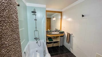 Bathtub, hair dryer, towels