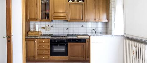 Fridge, oven, dishwasher, dining tables