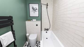 Bathtub, hair dryer, towels