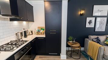 Coffee/tea maker, fridge, microwave, oven