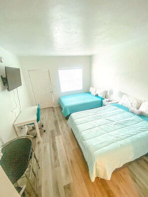 Signature Studio Suite, Multiple Beds, Pool View | Desk, free WiFi