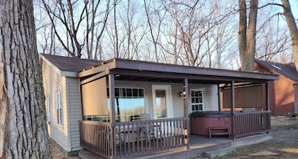 Riverfront Cottage with Hot Tub, Kayaks, Canoes, & Fishing Boats!
