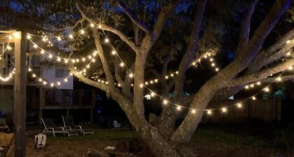 Tidal creek with 4 kayaks and a canoe. sunset views