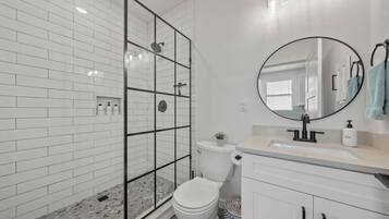 Shower, hair dryer, towels, soap