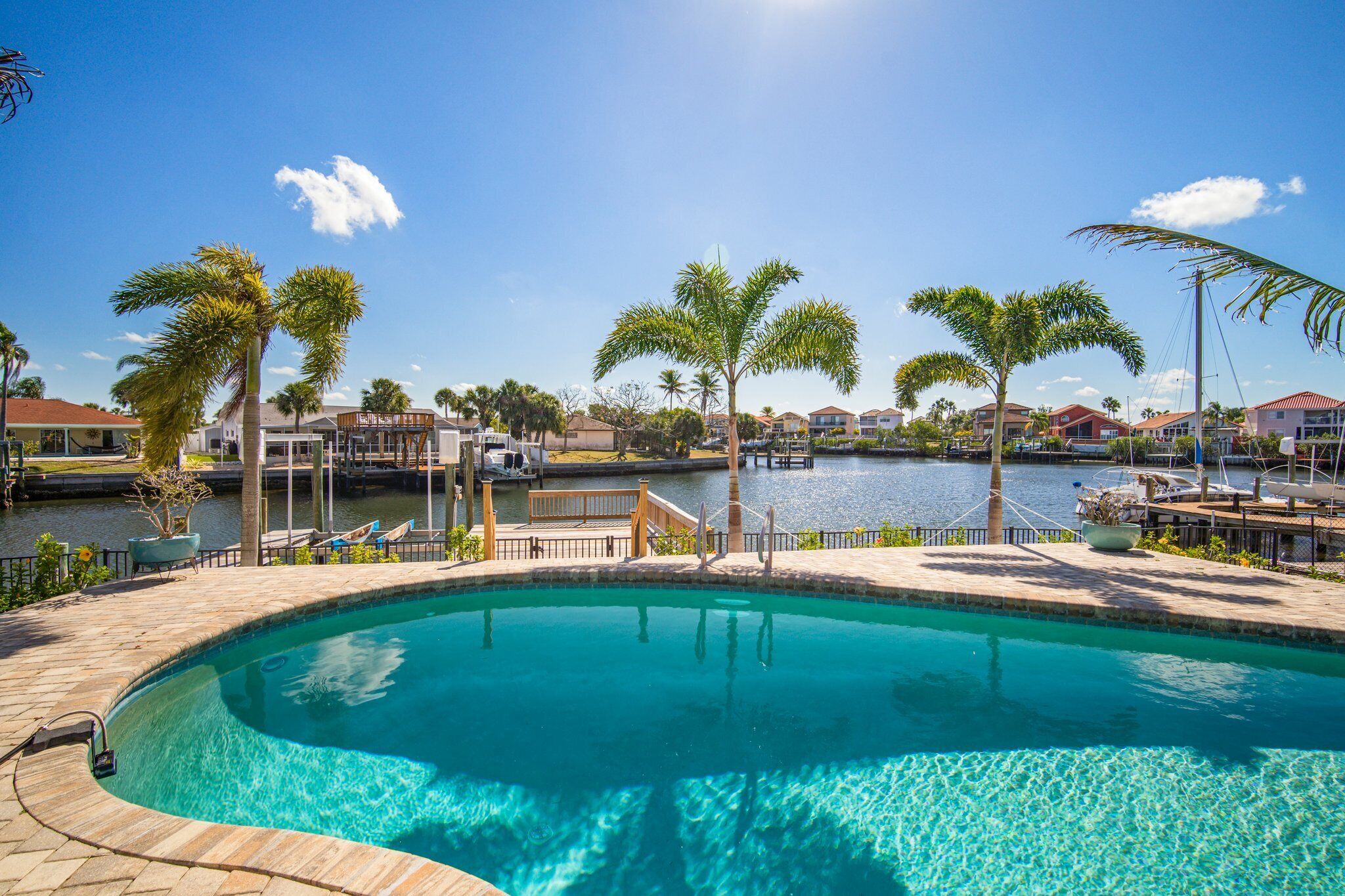 Saltwater canal front 4 bedroom tropical home with private pool and boat dock