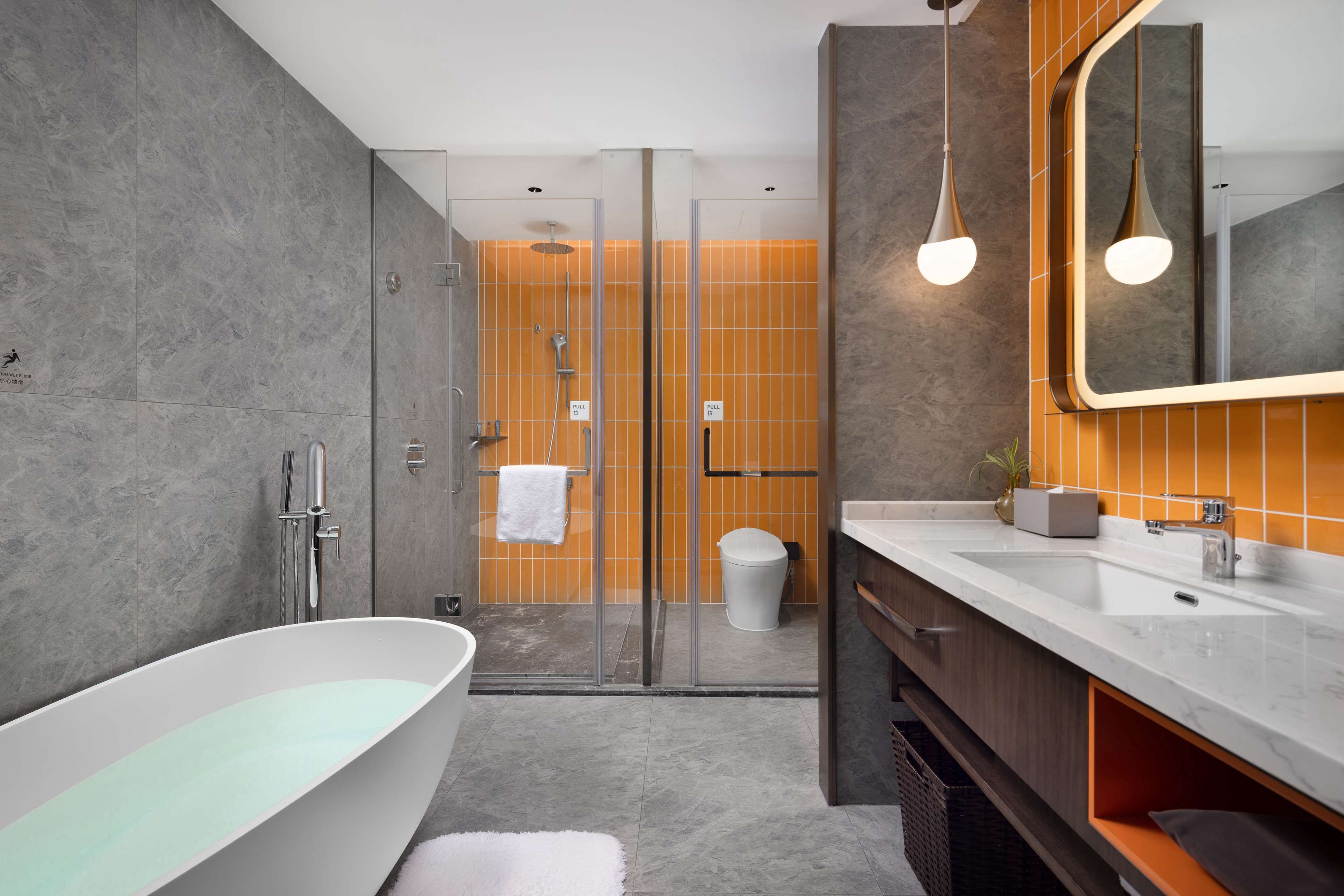 grand room | bathroom | shower, rainfall showerhead, designer toiletries, hair dryer