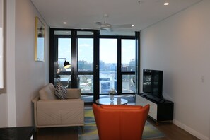 1 Bedroom Urban View - Free WIFI | Living room | 50-inch Smart TV with digital channels, TV - Kooii Apartments (Fortitude Valley)