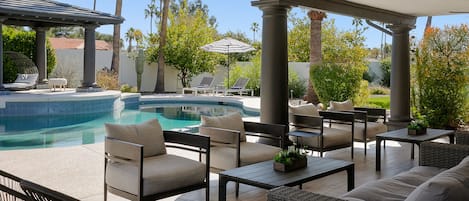 A heated pool, sun loungers
