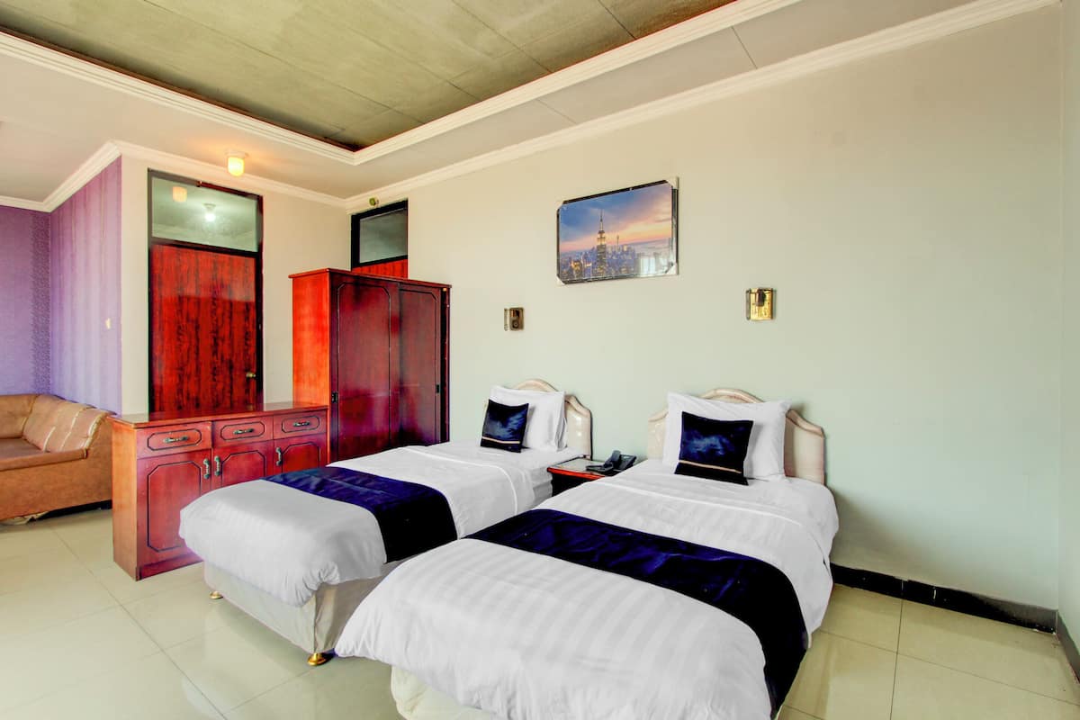 Habitación superior con 2 camas individuales | Wifi gratis y ropa de cama