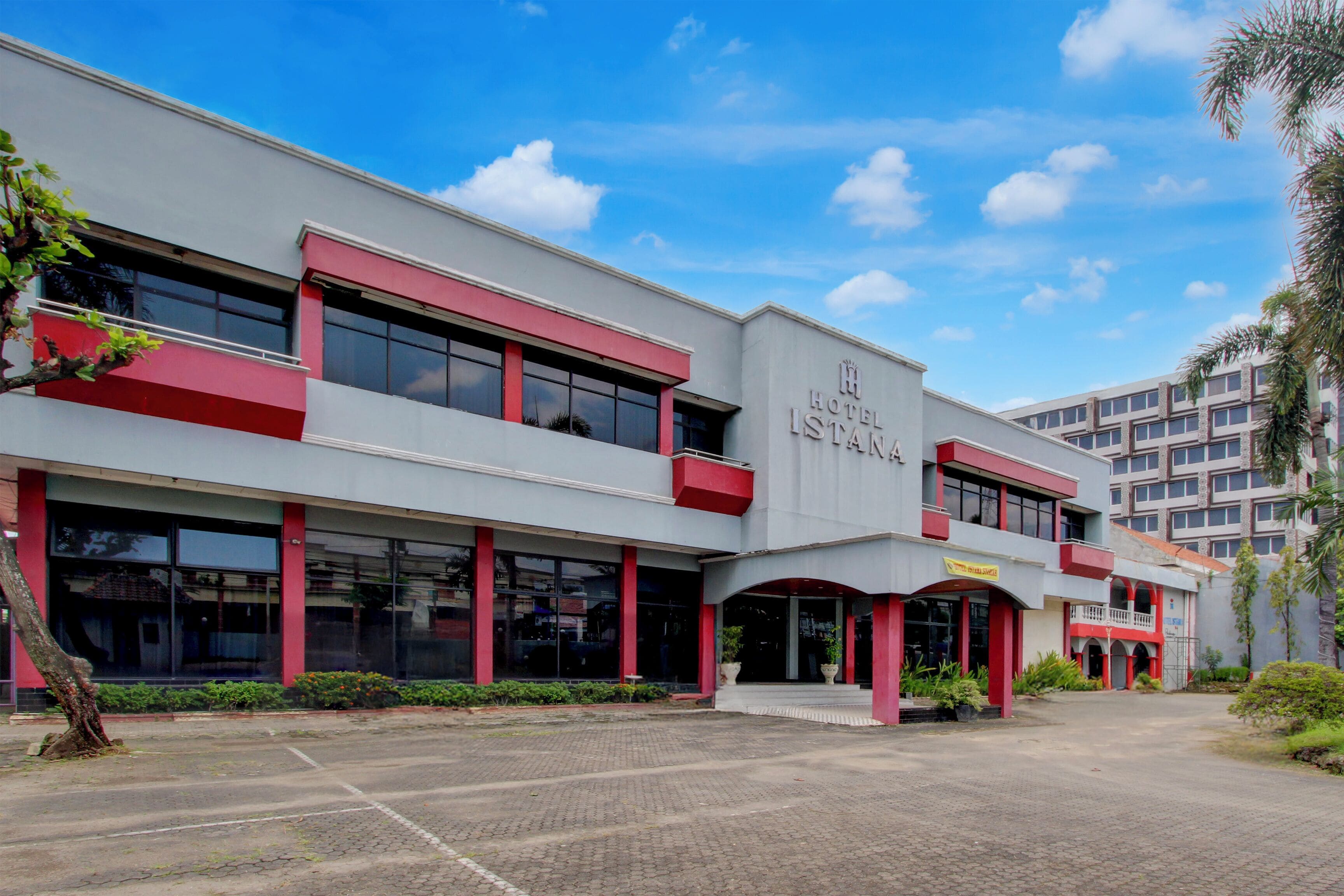 A hotel with a modern facade, large windows, and a prominent entrance.