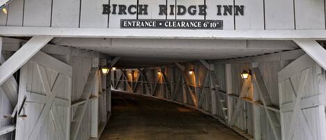 The entrance to the Birch Ridge Inn with a sign indicating a clearance of 6 feet 10 inches.