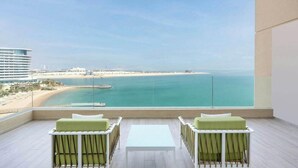 A balcony with a view of the beach and ocean. - Agora, Doha, Autograph Collection (Lusail)