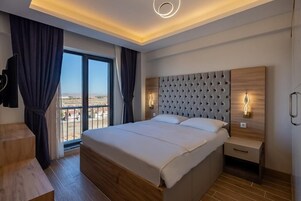 Suíte família, 1 quarto | Roupas de cama de algodão egípcio, roupas de cama premium